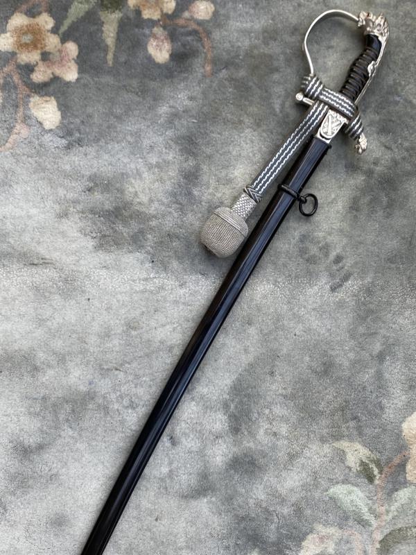 A BEAUTIFUL MINT SILVER HILT LIONS HEAD TRIPLE ETCHED SWORD FOR A THIRD REICH SHOOTING CLUB.