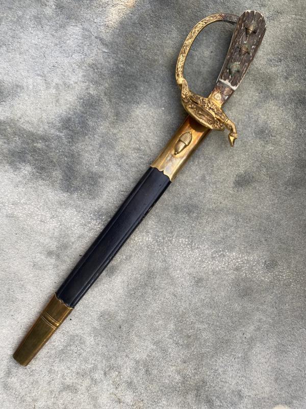 A VERY RARE FORESTRY CUTLASS BY HOLLER WITH EAGLE & SWAZ IN THE FERRELL
