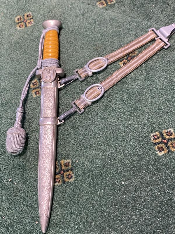 A FINE EXAMPLE OF A RED CROSS OFFICERS DAGGER WITH HANGERS AND KNOT.