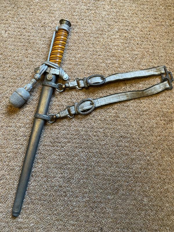 ARMY DAGGER WITH KNOT AND HANGERS HAS FULL DISTRIBUTOR NAME ON THE BLADE!