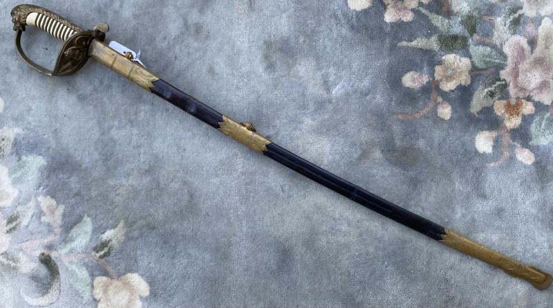 IMPERIAL GERMAN NAVAL SWORD WITH HAMMERED SCABBARD.