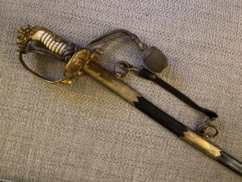 A BEAUTIFUL IMPERIAL NAVAL OFFICERS SWORD BY  WK&C WITH ORIGINAL RED/BLACK KNOT.