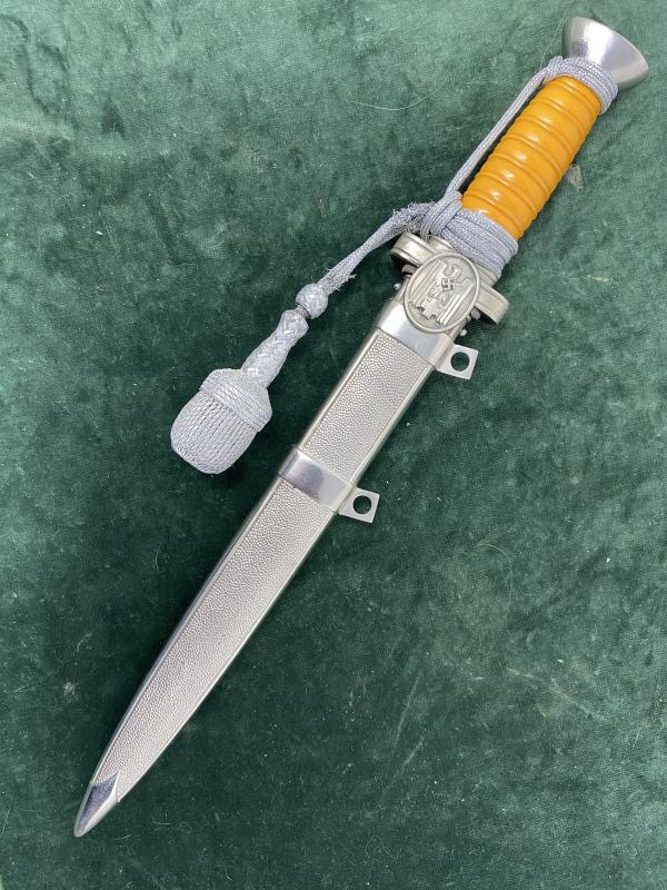 A LOVELY RED CROSS/SOCIAL WELFRE OFFICERS DAGGER WITH ORIGINAL KNOT.