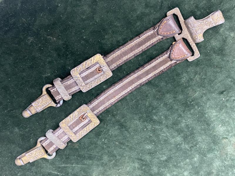 A NICE AFFORDABLE SET OF DE-LUXE, LEATHER TOPPED LUFTWAFFE DAGGER HANGERS.