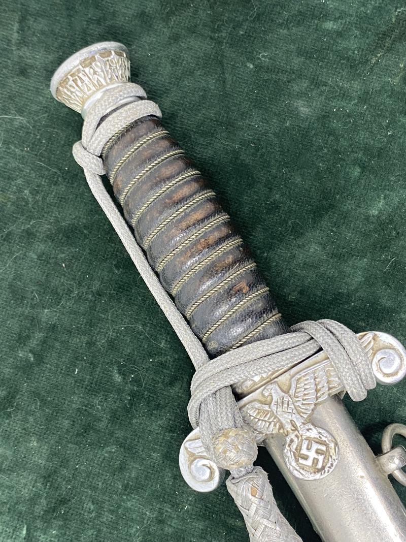 LAND CUSTOMS DAGGER WITH KNOT BY CLEM & JUNG.