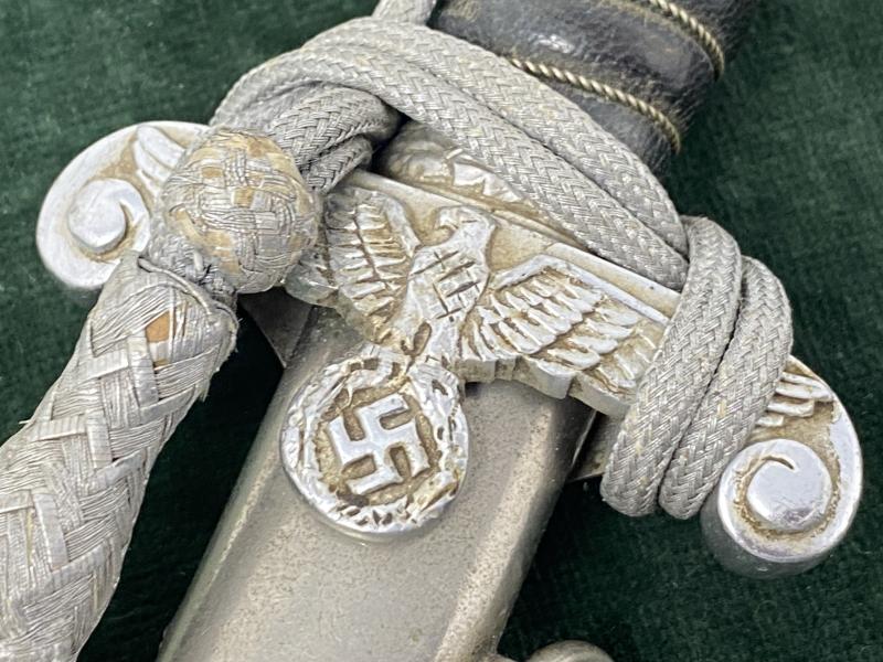 LAND CUSTOMS DAGGER WITH KNOT BY CLEM & JUNG.