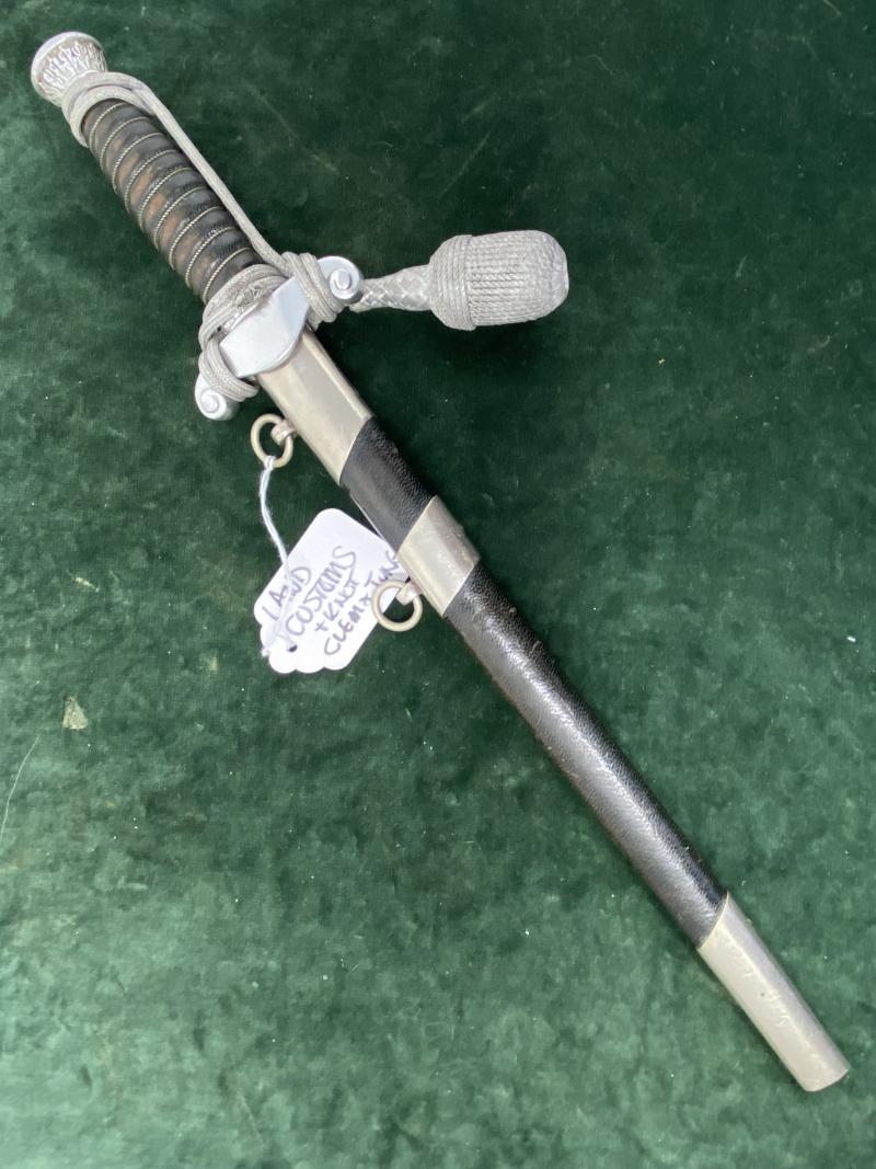 LAND CUSTOMS DAGGER WITH KNOT BY CLEM & JUNG.