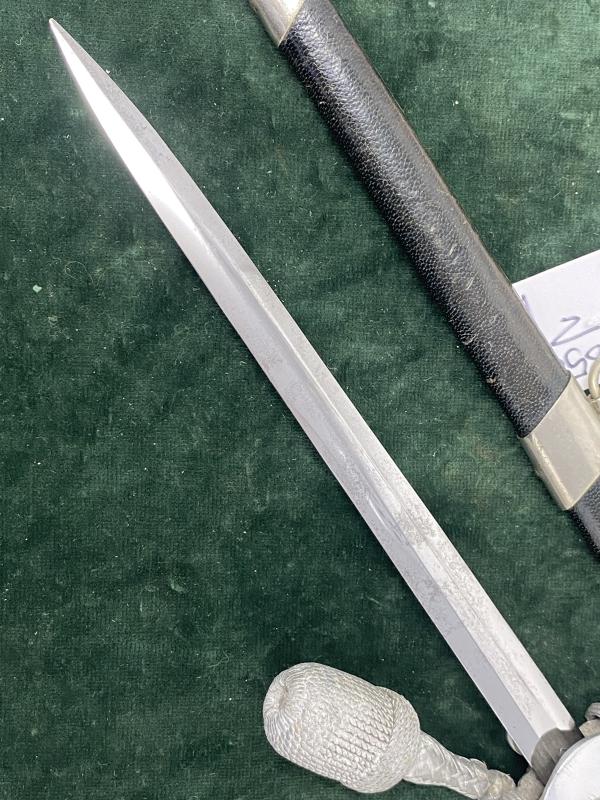 LAND CUSTOMS DAGGER WITH KNOT BY CLEM & JUNG.