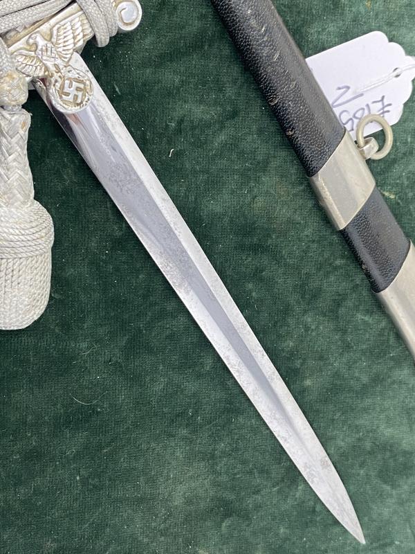 LAND CUSTOMS DAGGER WITH KNOT BY CLEM & JUNG.
