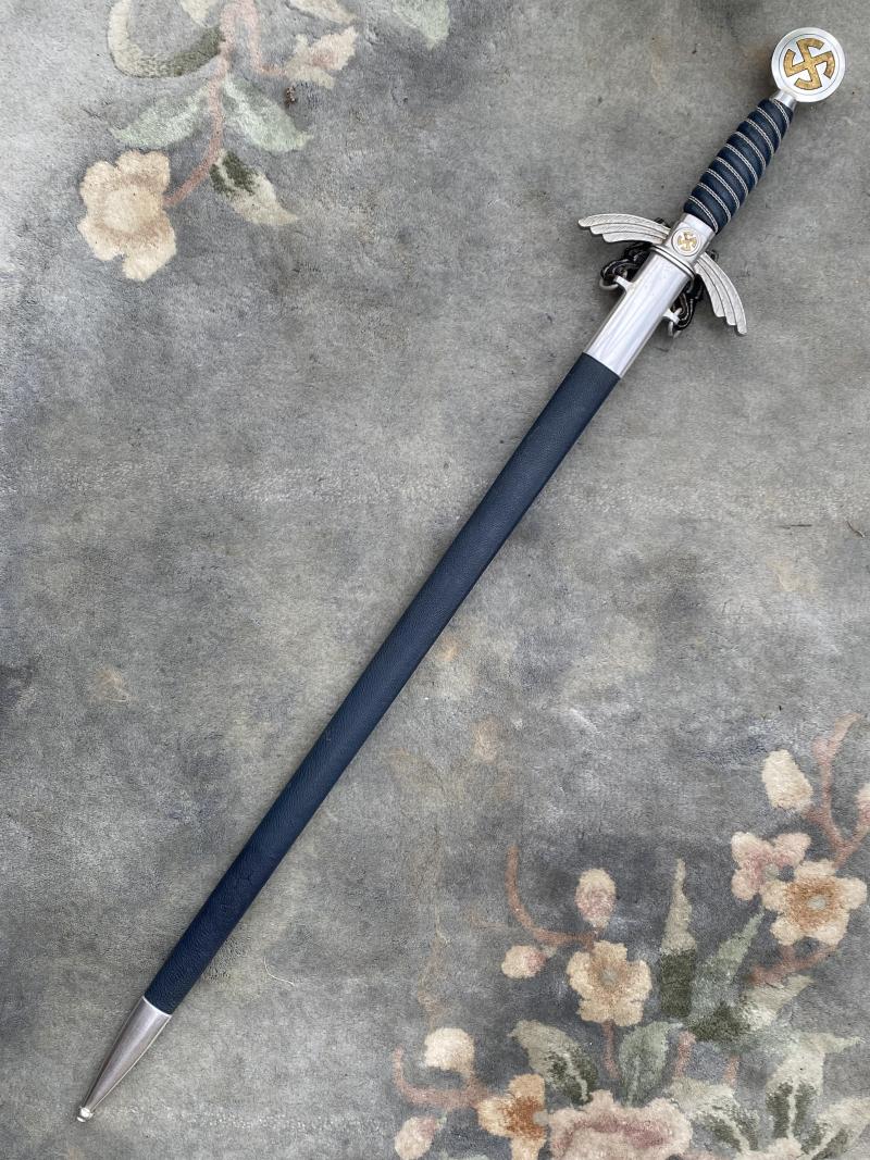 AN ALUMINIUM LUFTWAFFE SWORD IN Nr MINT CONDITION WITH UNUSUAL HANGER.