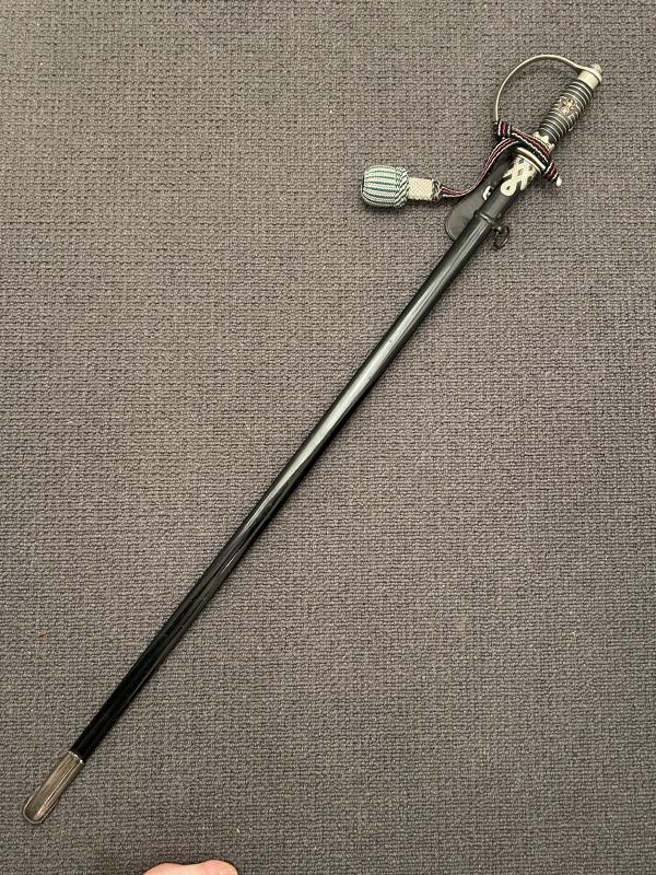 A MINT CONDITIONED POLICE OFFICERS DEGEN WITH ENGRAVED SS POMMELL, KNOT & HANGER.