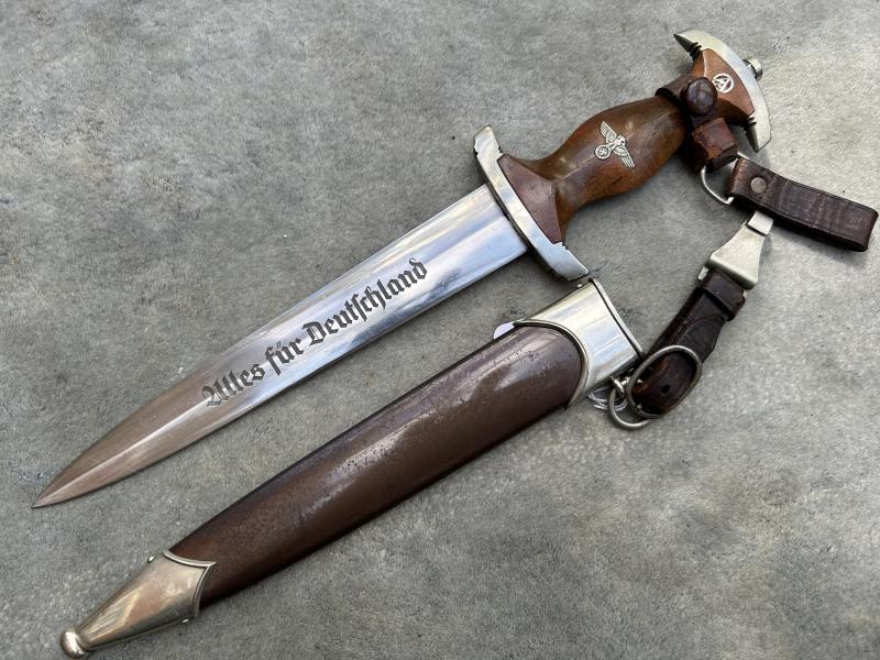 A WONDERFUL EXAMPLE OF AN EARLY SA DAGGER BY EICKHORN WITH FULLY ERASED ROHM DEDICATION AND A COMPLETE 3-PIECE HANGER.