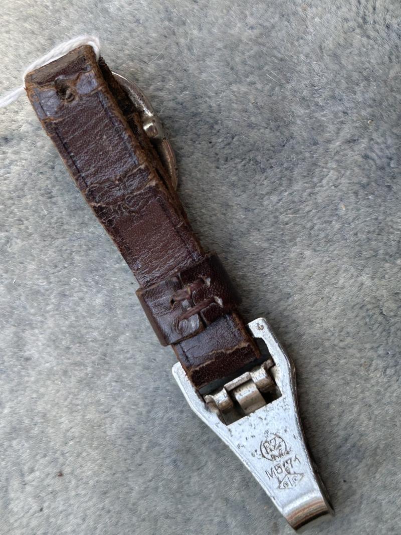 A MOST UNUSUALLY MARKED SA DAGGER HANGER.