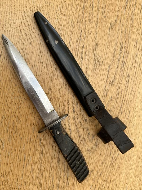 FIGHTING KNIFE WITH ADDED HJ BADGE.