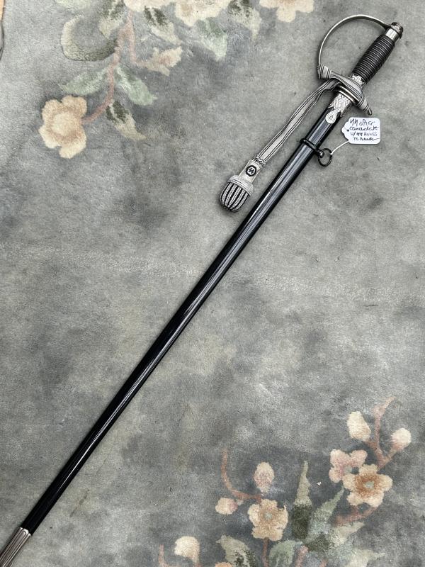 A UNIQUE EXAMPLE OF THE RARE SS ‘OFFICER CANDIDATE’ SWORD WITH INITIALS ON THE BLADE AND SS RUNES IN THE POMMEL.