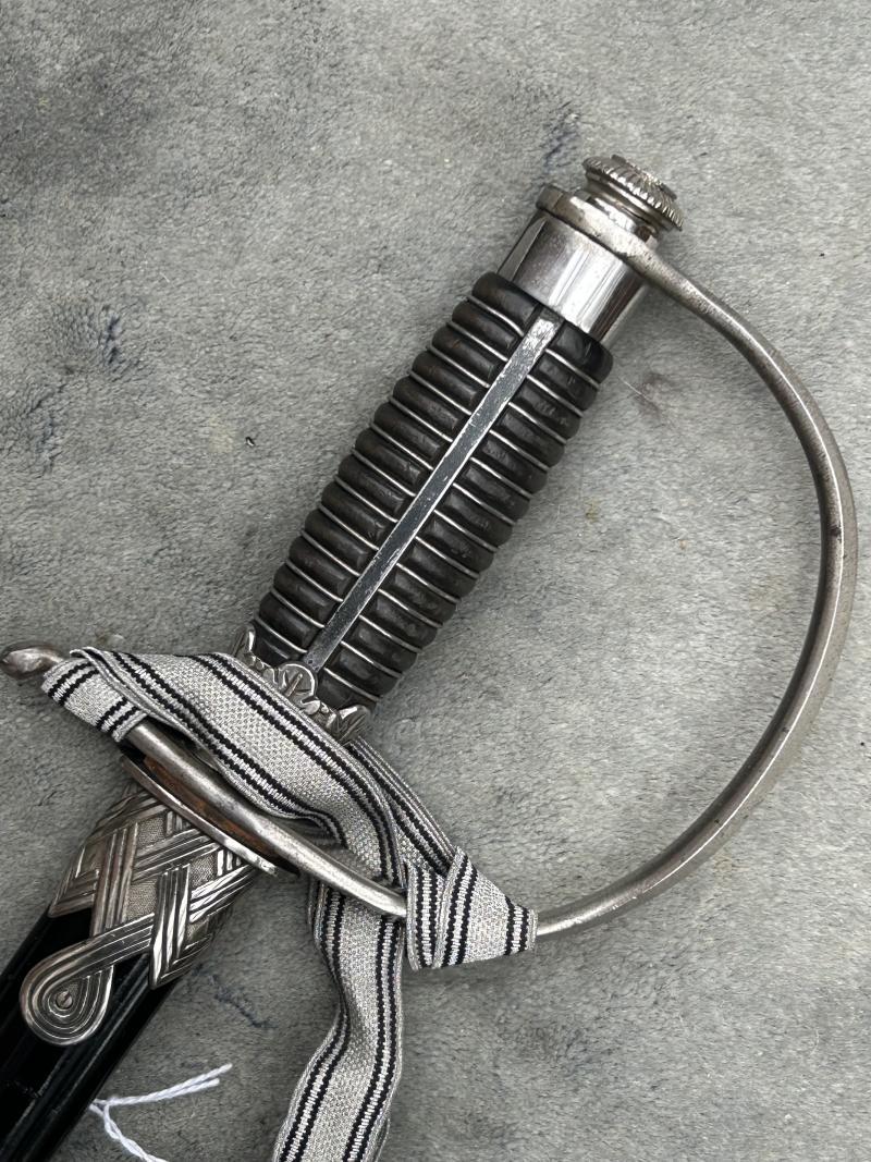 A UNIQUE EXAMPLE OF THE RARE SS ‘OFFICER CANDIDATE’ SWORD WITH INITIALS ON THE BLADE AND SS RUNES IN THE POMMEL.