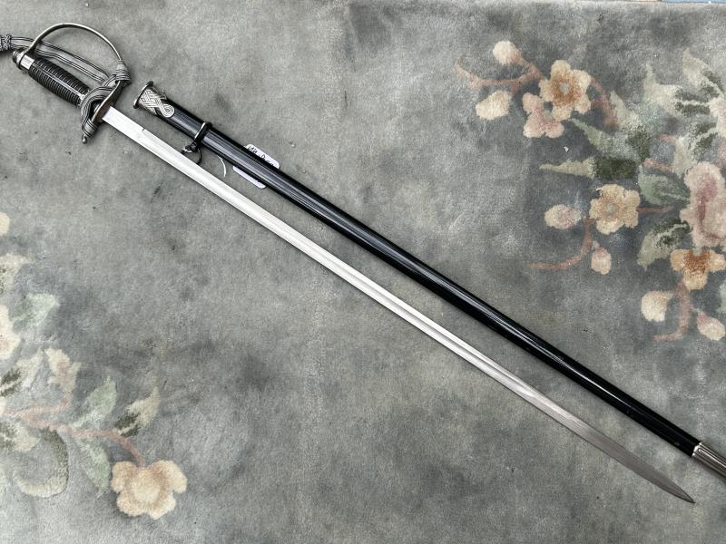 A UNIQUE EXAMPLE OF THE RARE SS ‘OFFICER CANDIDATE’ SWORD WITH INITIALS ON THE BLADE AND SS RUNES IN THE POMMEL.