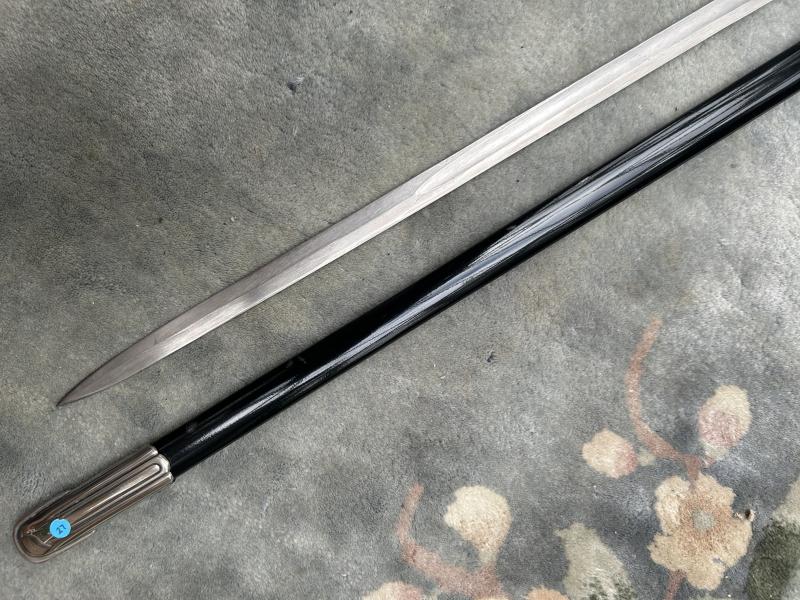 A UNIQUE EXAMPLE OF THE RARE SS ‘OFFICER CANDIDATE’ SWORD WITH INITIALS ON THE BLADE AND SS RUNES IN THE POMMEL.