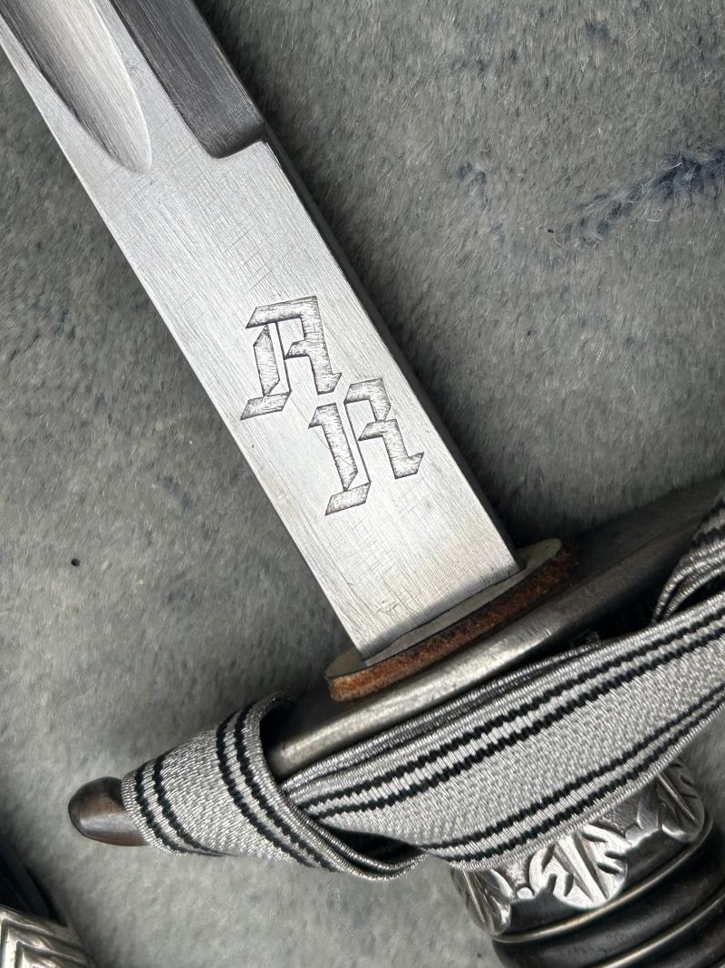A UNIQUE EXAMPLE OF THE RARE SS ‘OFFICER CANDIDATE’ SWORD WITH INITIALS ON THE BLADE AND SS RUNES IN THE POMMEL.
